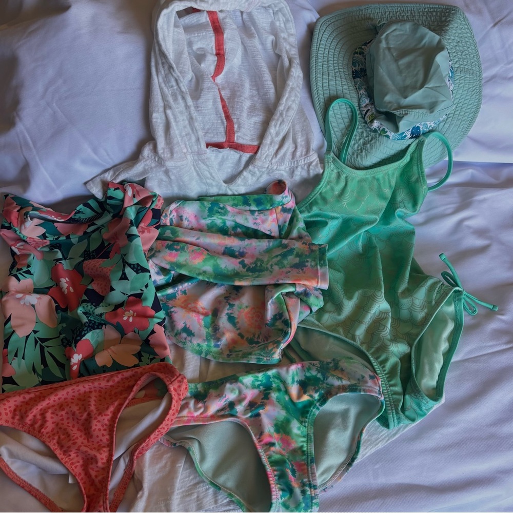 7 pc. Girls size 4-5 swim set. 3 swim suits, 1 cover-up, 1 hat